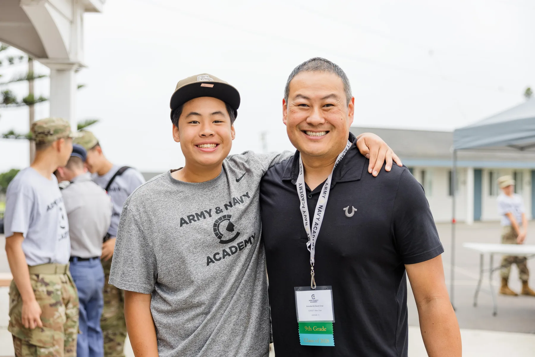 International student with a family member and Academy representative