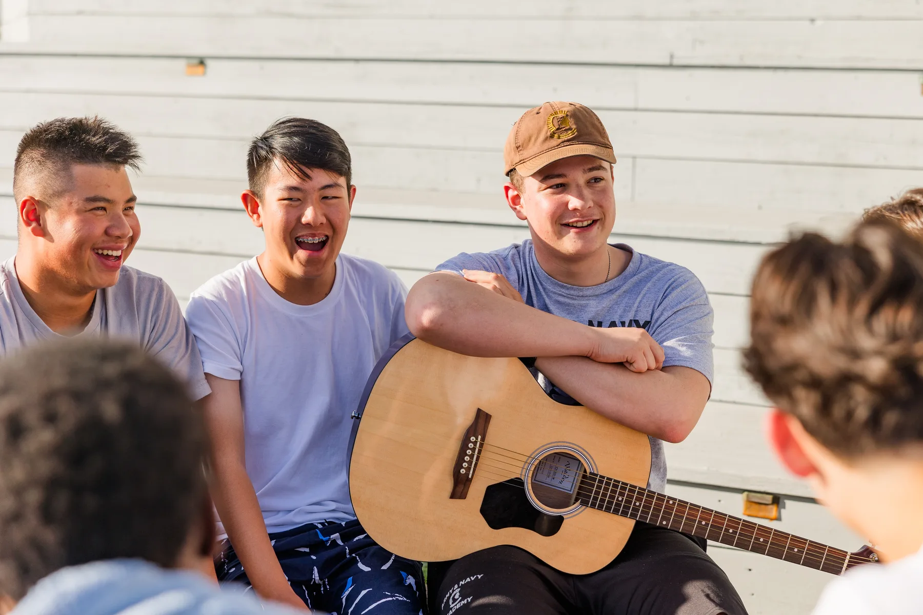 Students sharing music together on campus