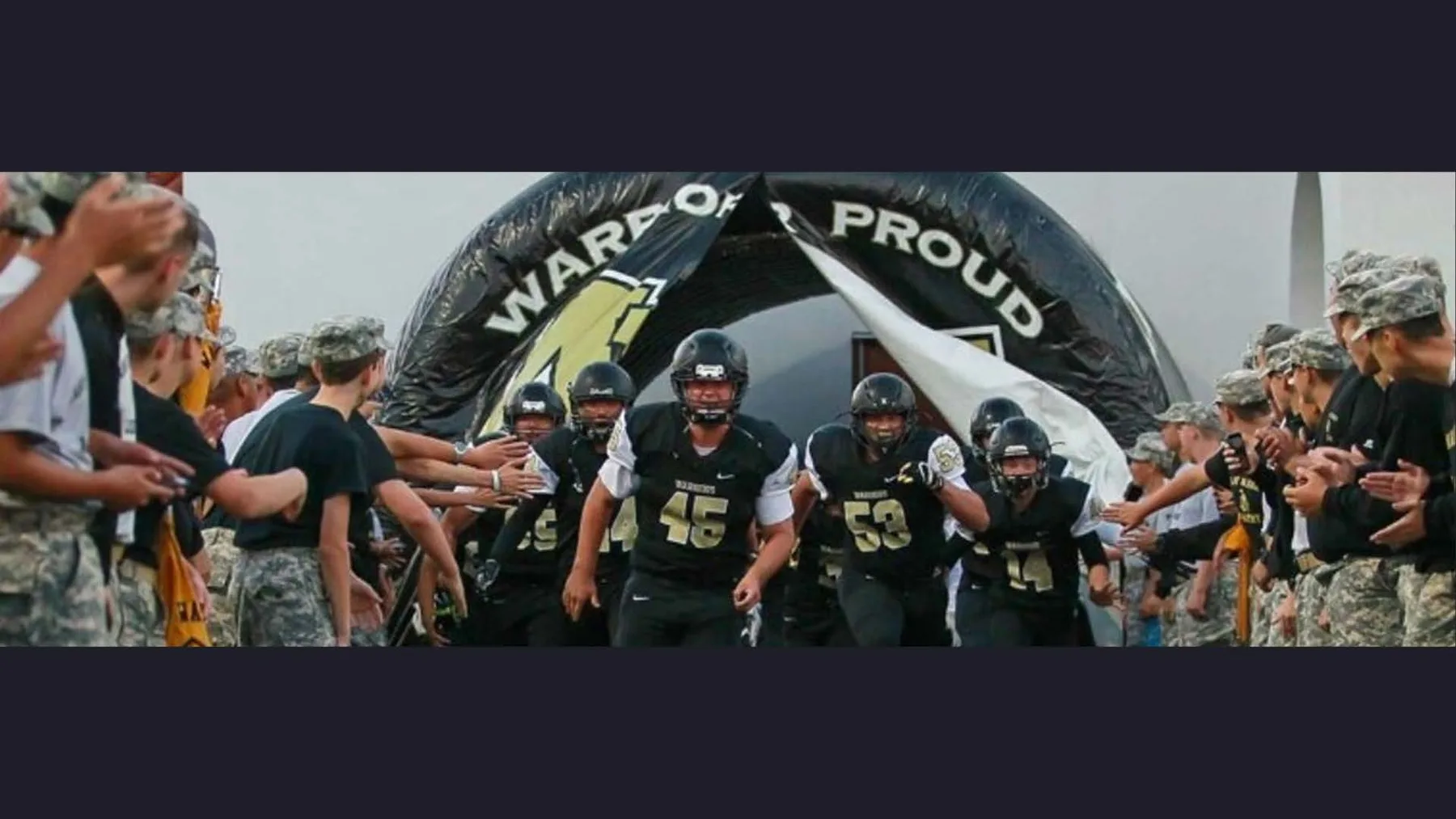 Army and Navy Academy football team entering the field